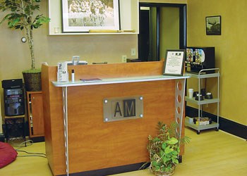 Interior of men's hair salon in Berwyn, PA with front desk and decorated walls